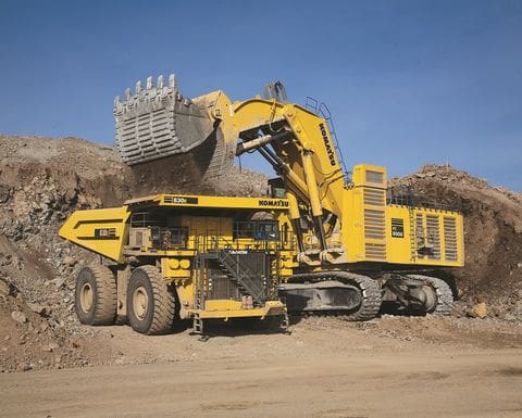 A large yellow dump truck with a big bucket.